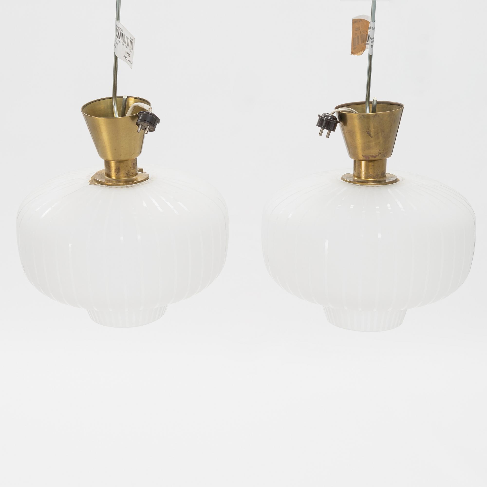 A pair of glass and brass Swedish Modern ceiling lights, Böhlmarks, 1940's.