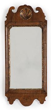 A George II gilt-gesso and walnut mirror, first part of the 18th century.