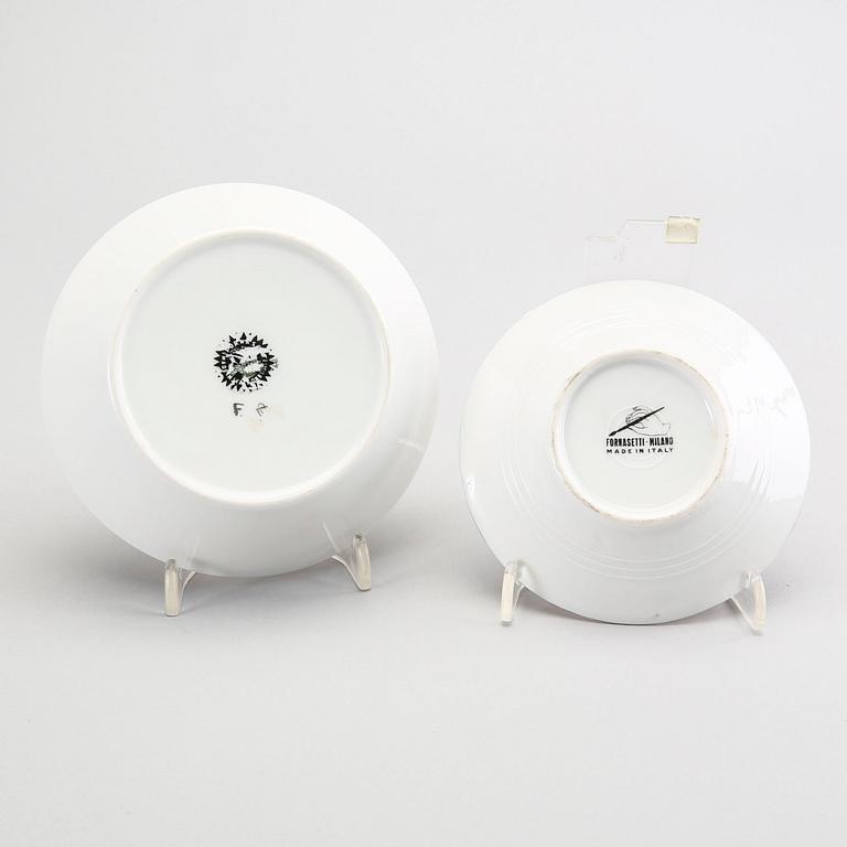 A st of three Piero Fornasetti porcelain plates.