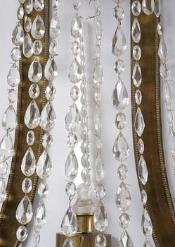 A pair of Russian Louis XVI-style  four-branch gilt bronze appliques, 19th century.