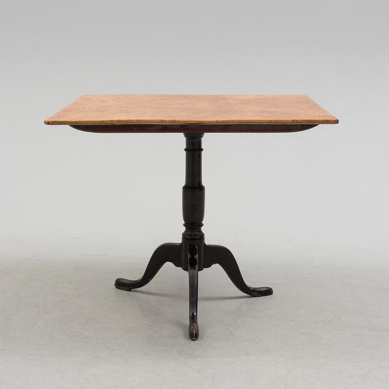 A 19th century folding table with root veneer.