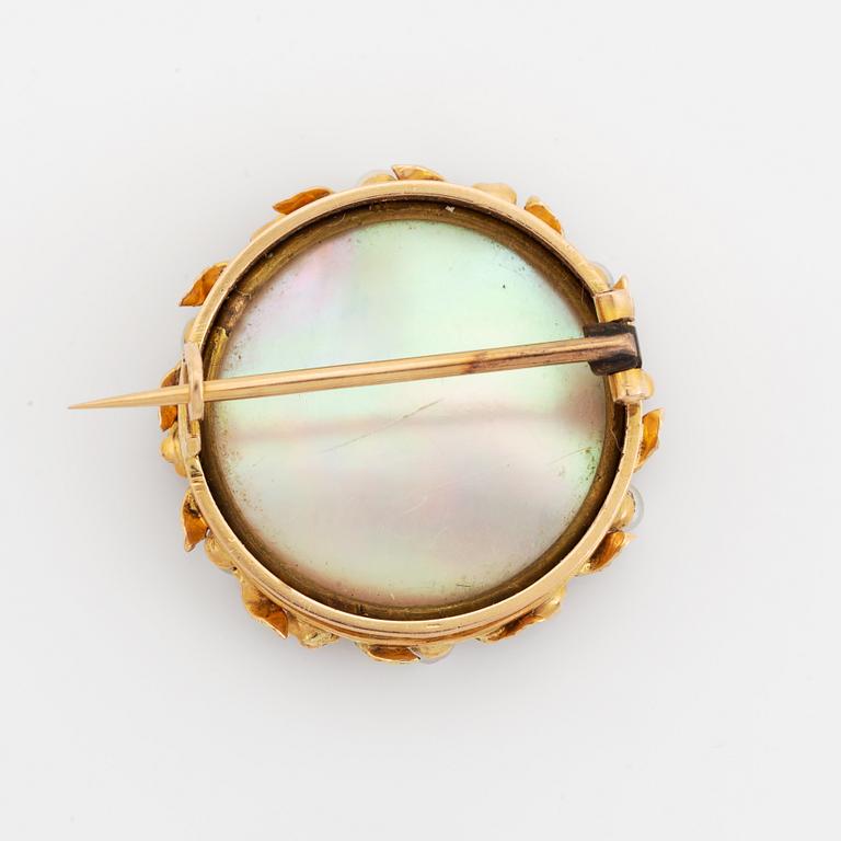 Brooch with miniature portrait on mother of pearl.