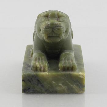 A Chinese stone figure of a lion, 20th century.