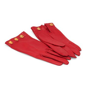 567. HERMÈS, a pair of red leather lady gloves.