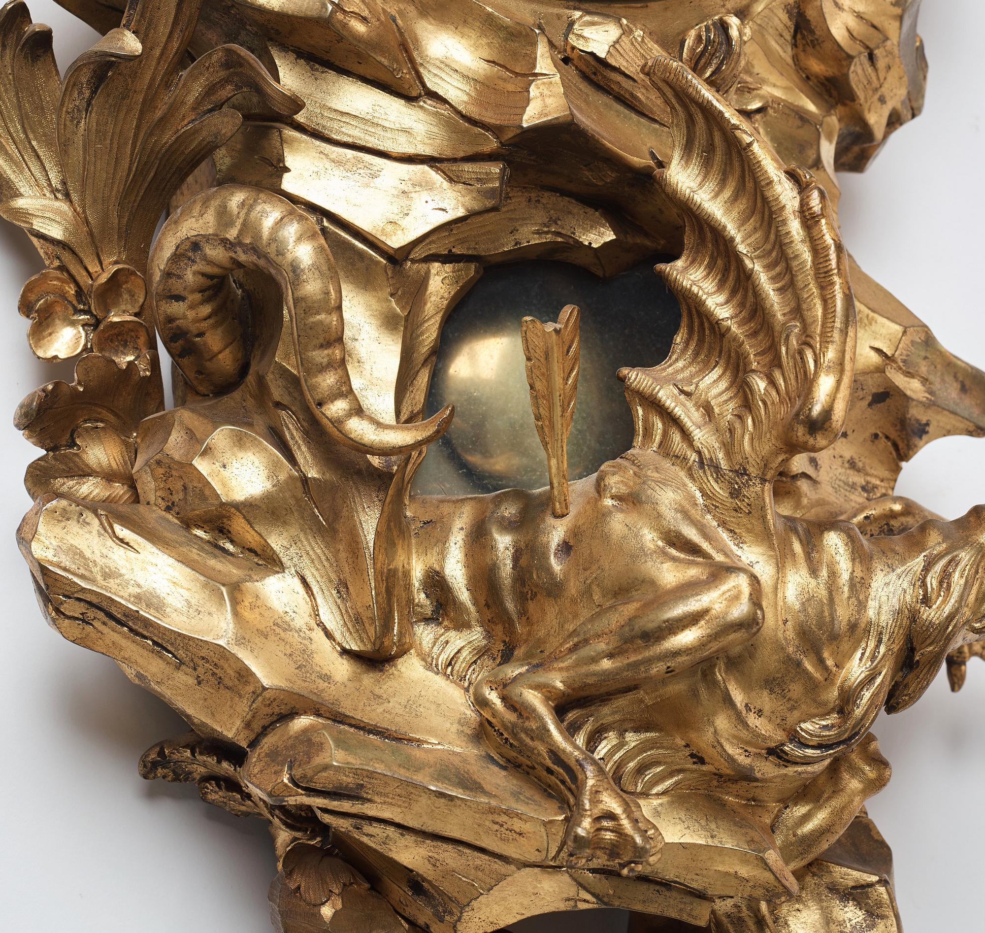 A Louis XV mid 18th century gilt bronze wall clock marked "Caffieri fecit".