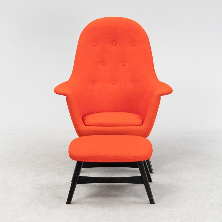 A 'Benarp/Genua easy chair with foot stool from Ikea,.