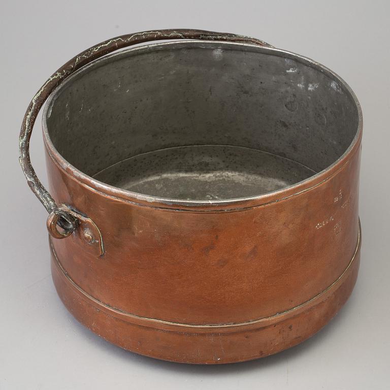 A 18th century copper cauldron.