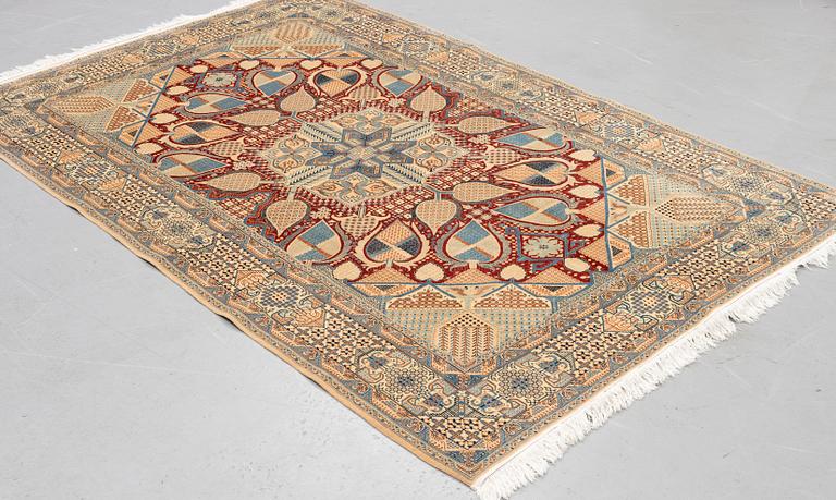 A rug, Old Nain, part silk, ca 257 x 165 cm.