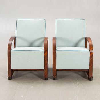 A pair of Art deco walnut armchairs first half of the 20th century.