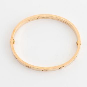 A Cartier "Love" bracelet in 18K gold.