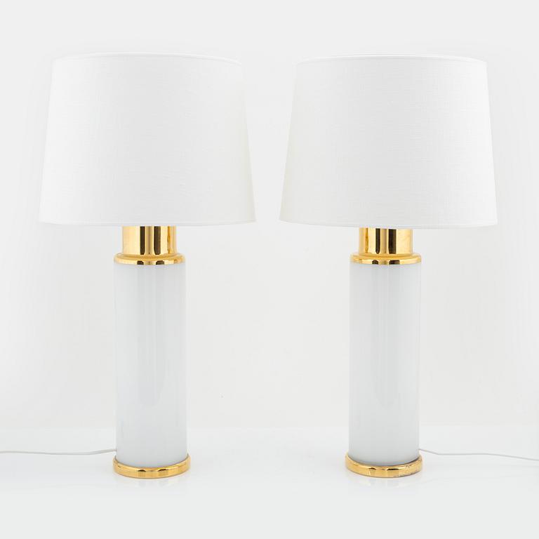 A pair of white and gold glass table lights, Luxus.