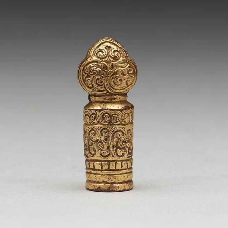 A Tibtean gilt bronze seal, presumably 18th Century.