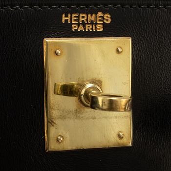 HERMÈS, a black leather 'Kelly' bag, 1970.