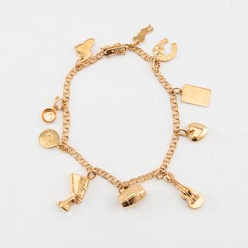 Bracelet with Bismarck link in 18K gold with charms.