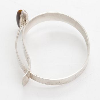 Elis Kauppi, A sterling silver bracelet with a tiger eye. Kupittaan Kulta, Turku 1961.