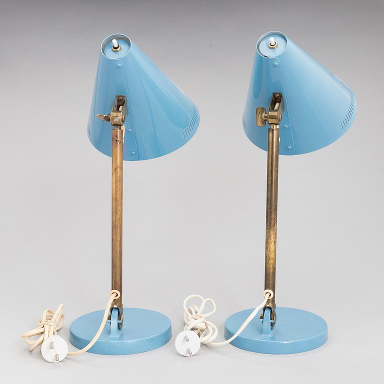 A pair of desk lamps by Paavo Tynell manufactured by Taito Oy.