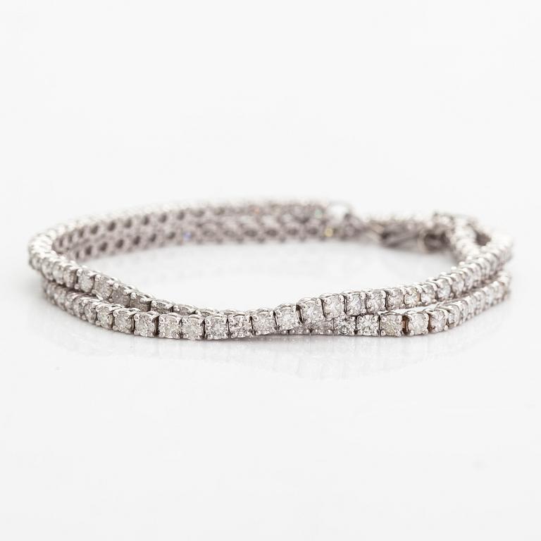 A tennis necklace/bracelet, 14K white gold and diamonds ca. 6.96 ct in total. AIG certifiacete.