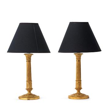 1267. A pair of French Empire early 19th century gilt bronze table lamps/candlesticks.