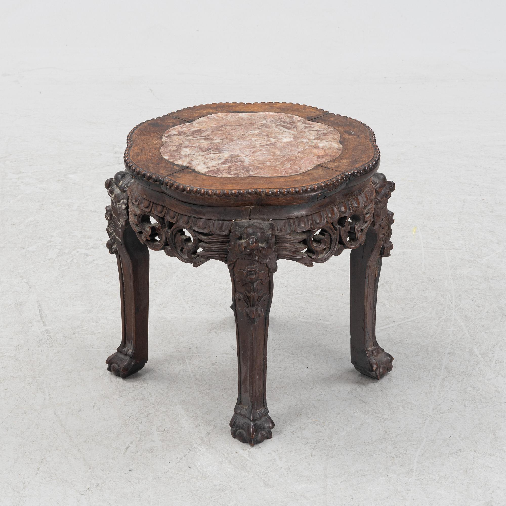 A Chinese hardwood stool, 20th Century.
