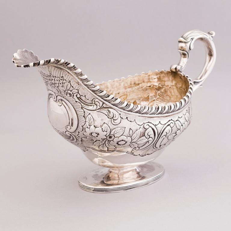 An English early 19th century silver cream-jug, mark of Abraham Peterson, London 1803.