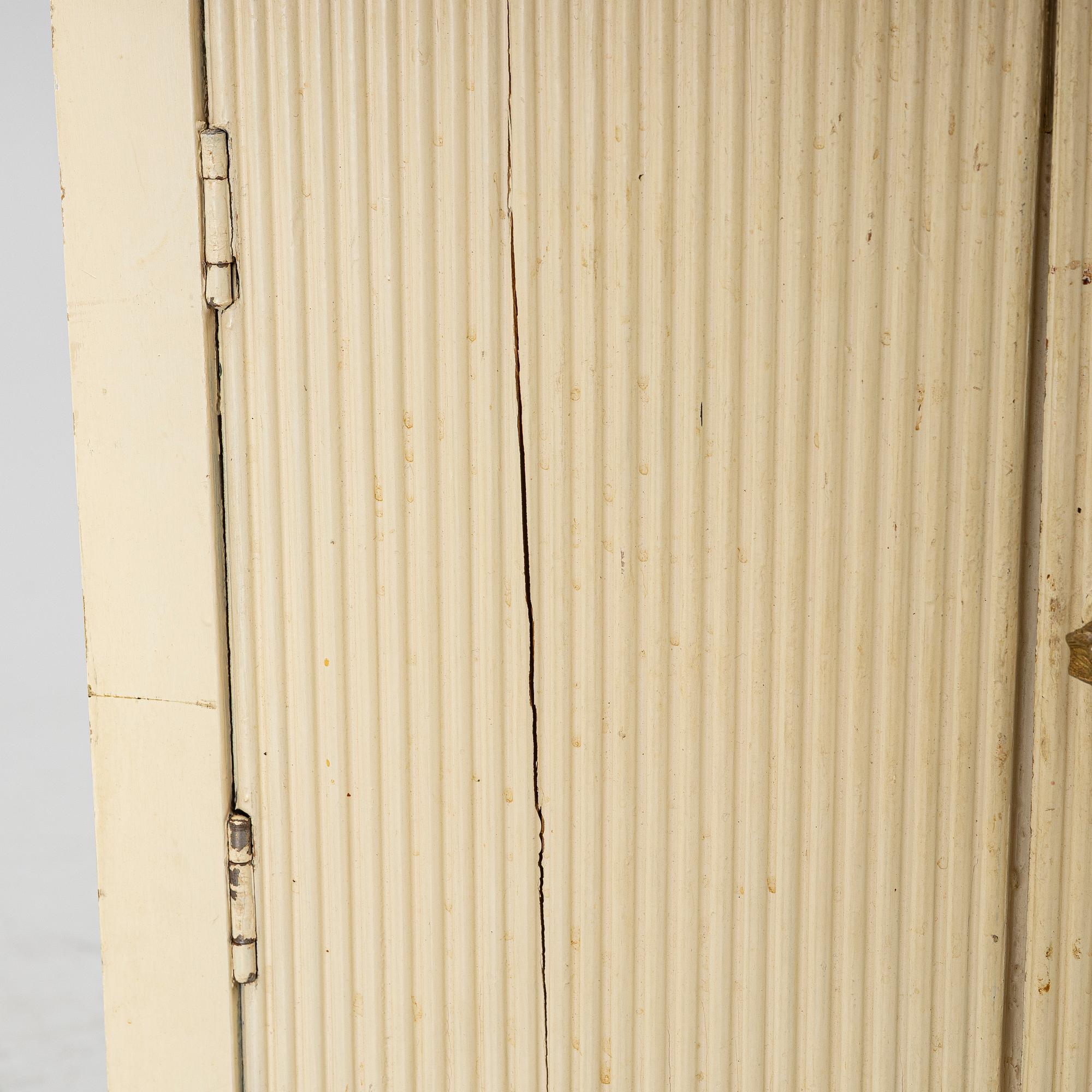 A Gustavian style bedside table, early 20th century.