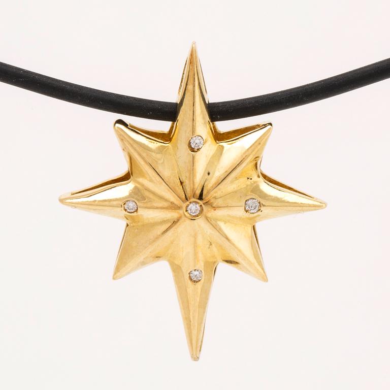 Hänge på latex, 18K med briljanter ca 0,03 ct, längd ca 40 cm, hänge ej avtagbart.