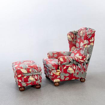 An easy chair with stool later part of the 20th century.