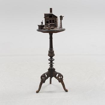 A late 19th century carved smoking table.