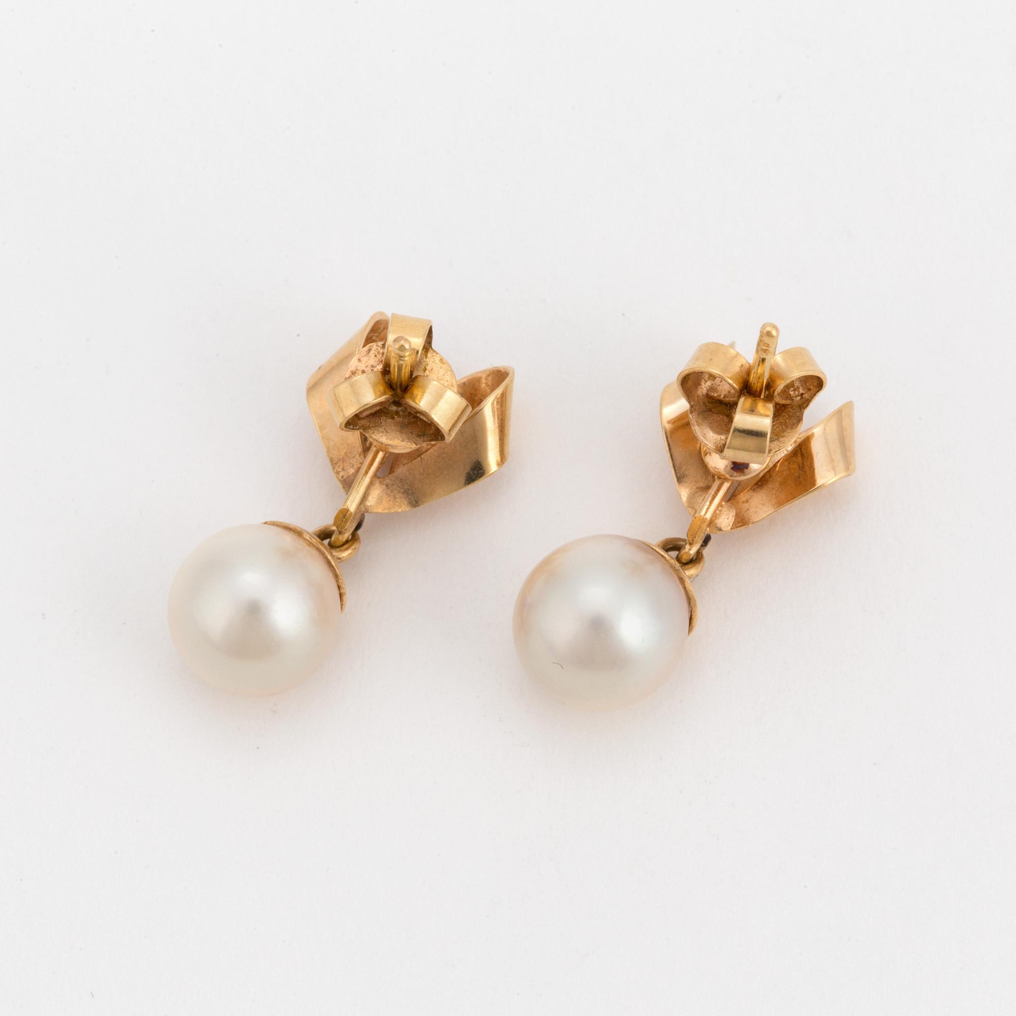 A pair of earrings set with cultured pearls.