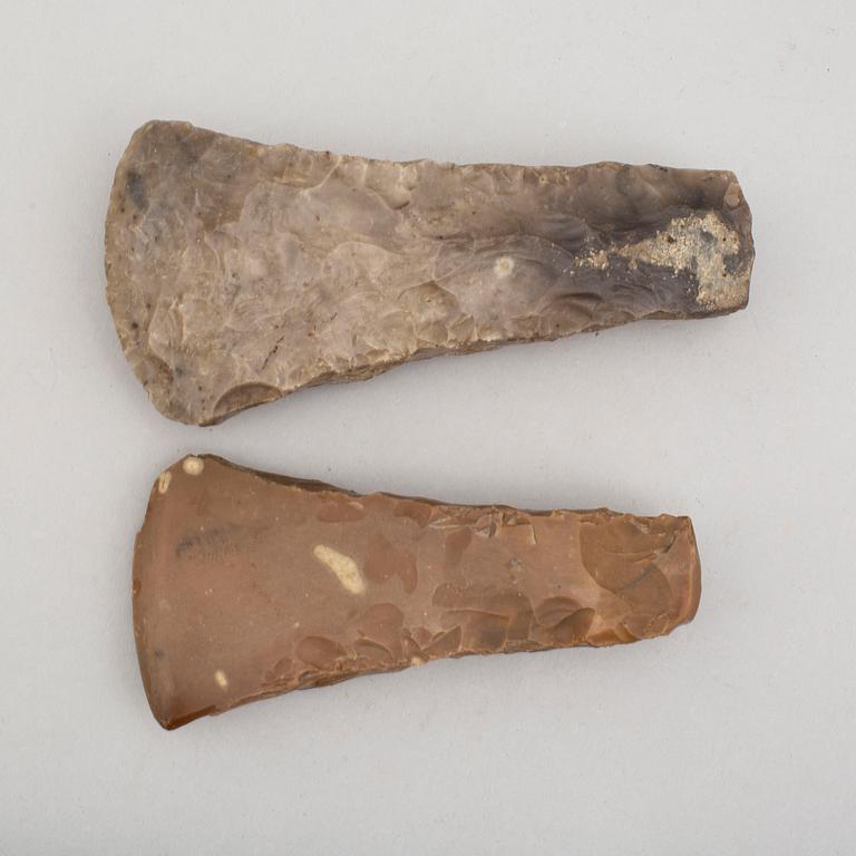 Two neolithic wide edged flint axes.