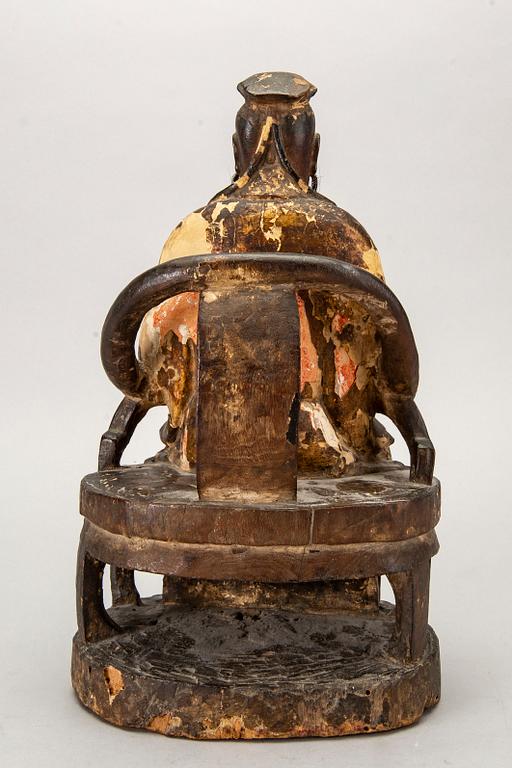 A Chinese late Qing painted wooden sculpture.