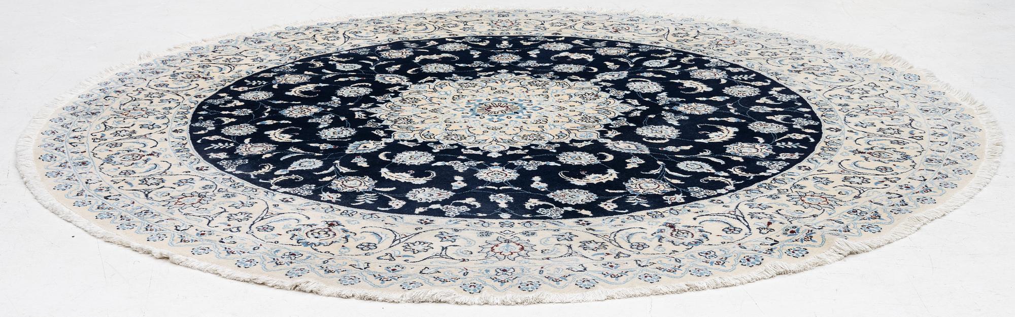 A Nain rug, diameter 243 cm.