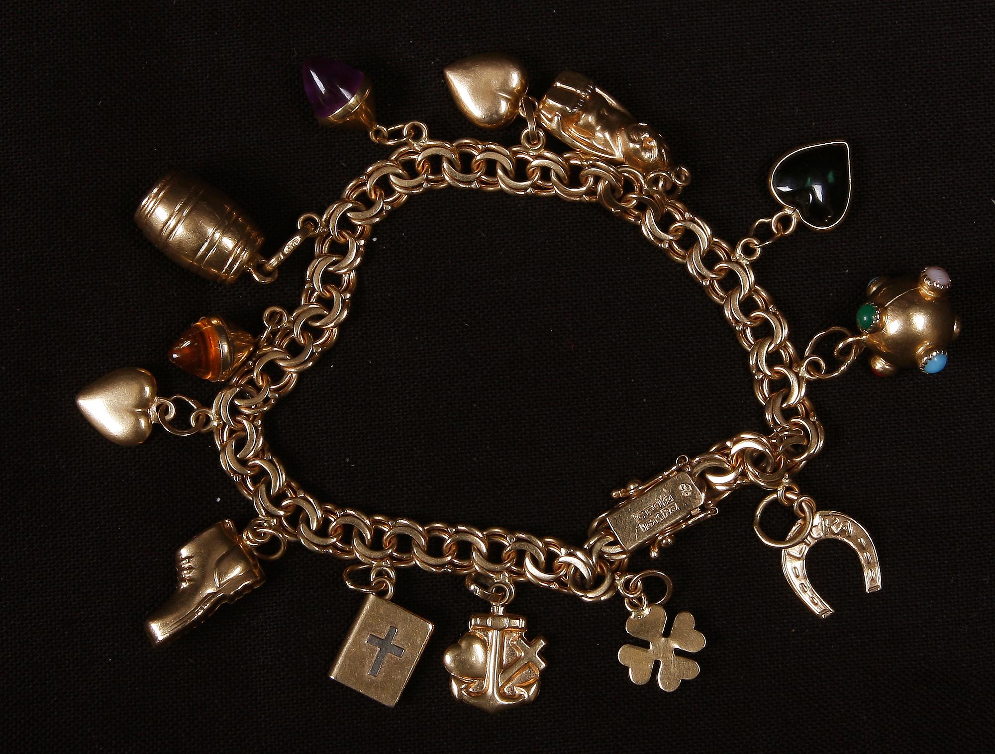 ARMBAND, 18 K guld samt halvädelstenar, Köping, 1967. Ca 22 g.