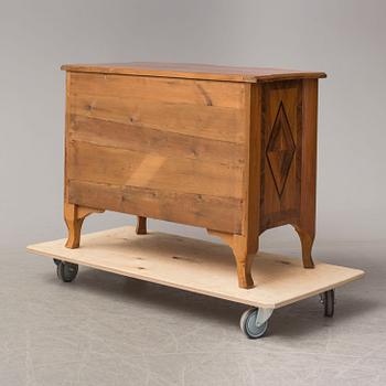 A baroque style chest of drawers circa 1900.