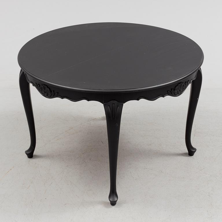 A mid 20th century rococo style dining table.