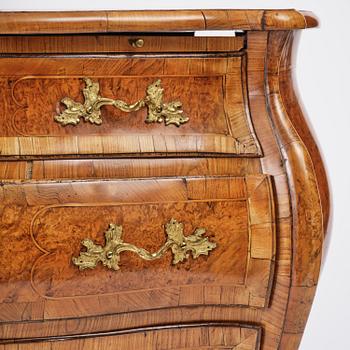 A burr alder parquetry rococo commode, Mälardalen, Sweden, later part 18th century.