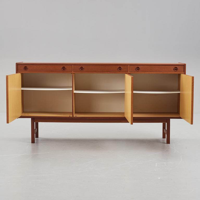 A late 20th Century teak veneered sideboard.