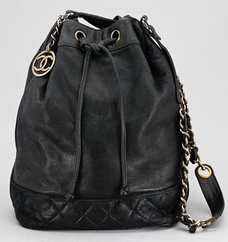 1245. A 1970s black leather shoulderbag by Chanel.