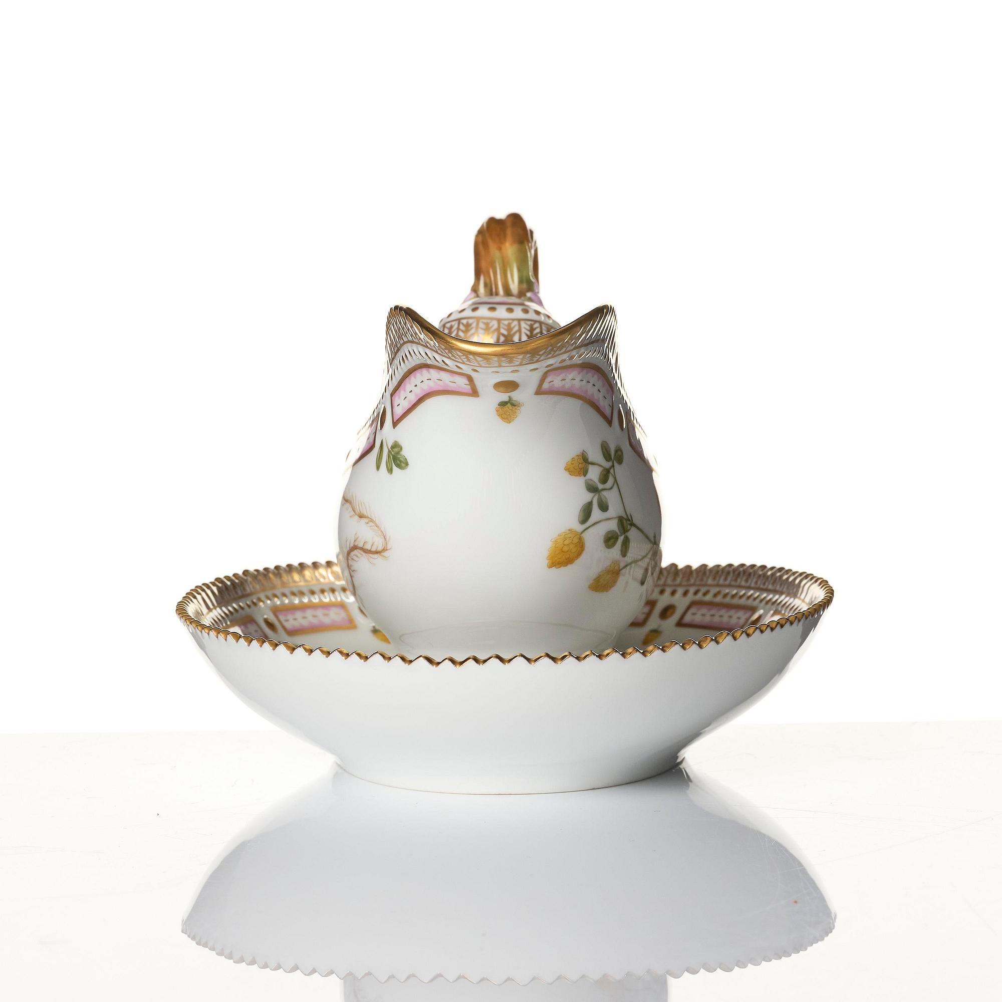 A Royal Copenhagen 'Flora Danica' sauce boat and a pillow shaped bowl, Denmark, 20th century.