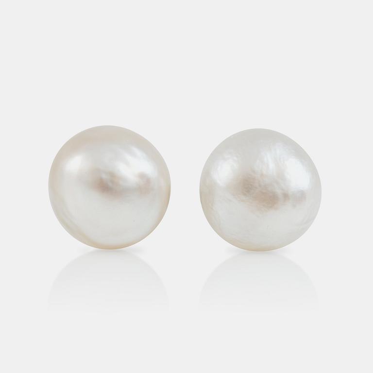 A pair of probably natural pearl earrings.