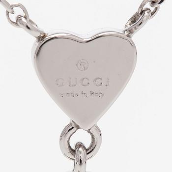 Gucci, an 18K white gold necklace with diamonds.