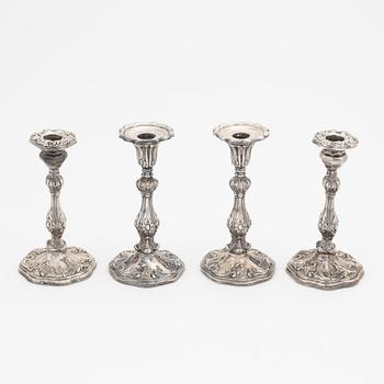 Two pairs of Swedish silver candlesticks, mark of A Lundqvist, Stockholm 1847 and JW Laurén, Stockholm 1854.