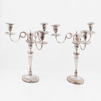 A pair of silver plated candelabra/candlesticks, England, first half of the 20th Century.