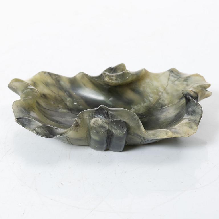 A Chinese green stone brush washer, a carved bone and a soapstone figure, partly Qing dynasty.