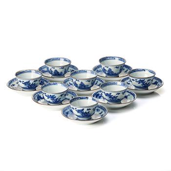 1099. A matched set of eight blue and white cups and stands, Qing dynasty, Kangxi (1662-1722).