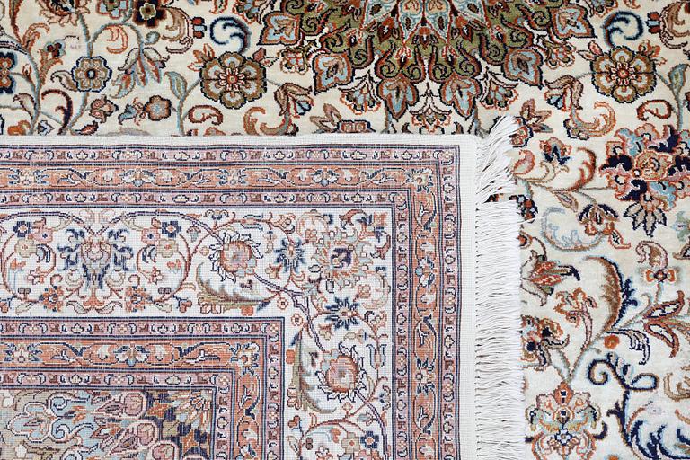 A Kashmir silk carpet, approx. 258 x 201 cm.