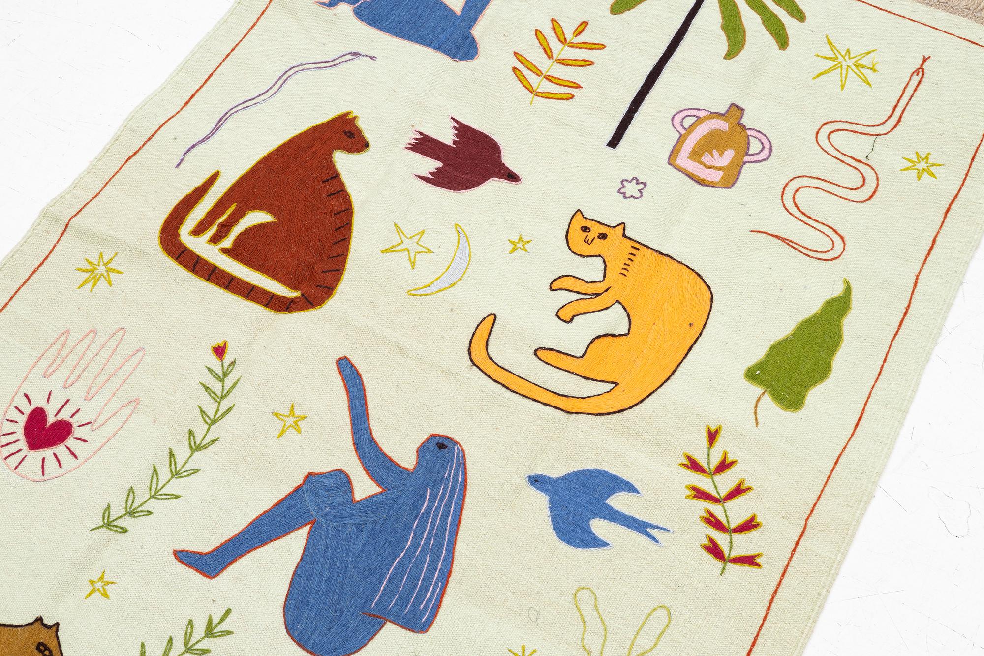 A hand-embroidered kilim rug, c. 186 x 125 cm.