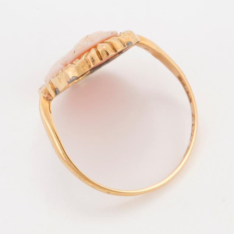 A ring with carved sea shell.