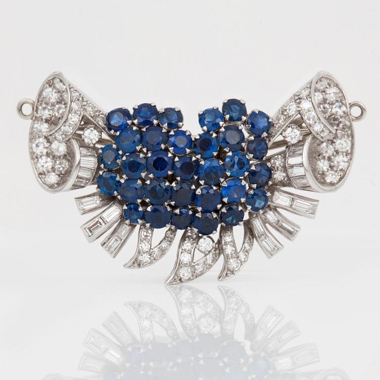 A diamond and sapphire set, probably Garrard & co. The set can be worn as a necklace, earrings, double clip or brooch.