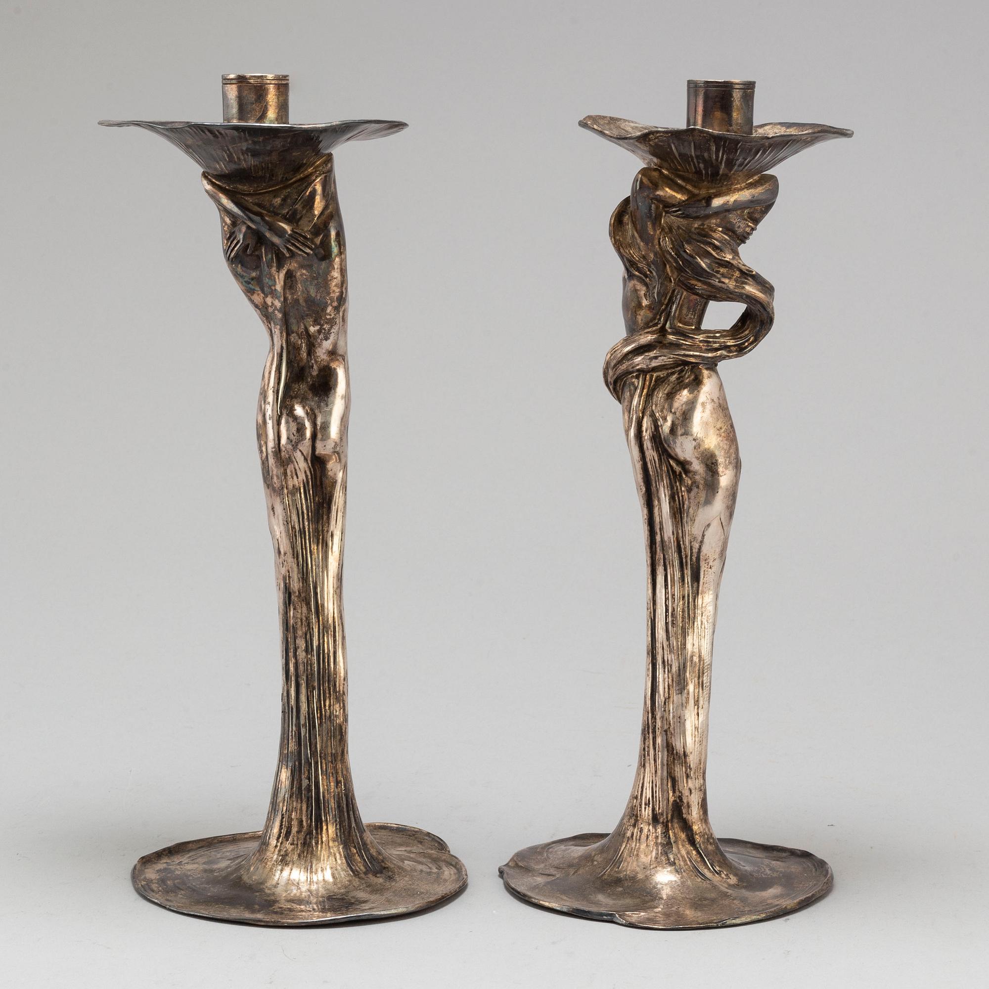A 20th Century pair of art noveau style candle sticks marked A.W.OX.